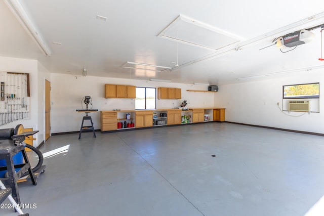 garage with a garage door opener and cooling unit