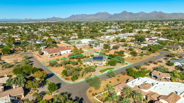 birds eye view of property with a mountain view