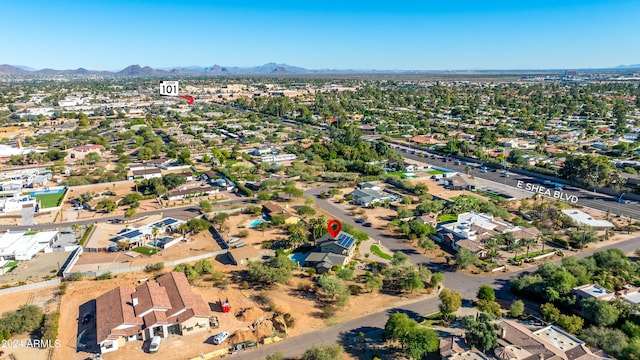 birds eye view of property with a mountain view