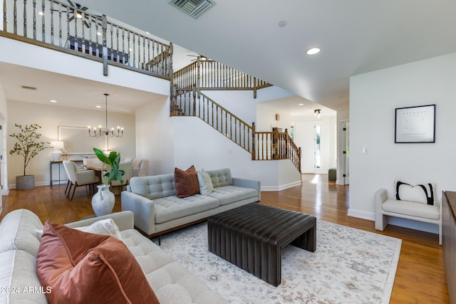 living room featuring hardwood / wood-style floors and a chandelier