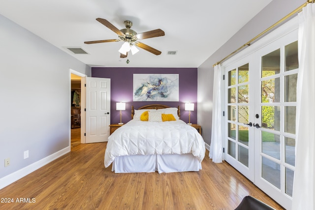 bedroom featuring french doors, hardwood / wood-style flooring, and ceiling fan