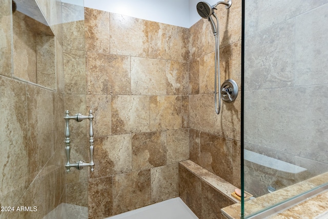 bathroom with tiled shower