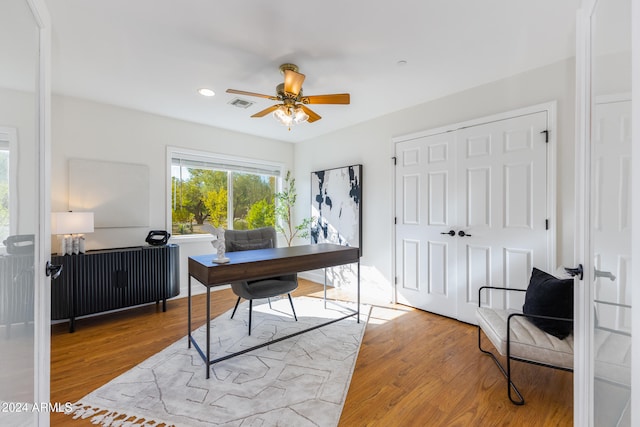 office with ceiling fan and wood-type flooring