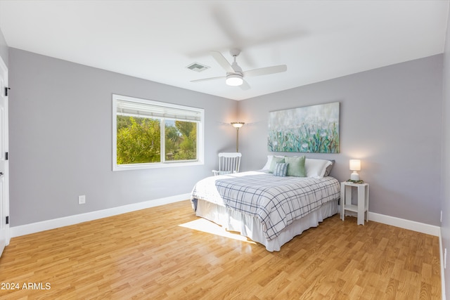 bedroom featuring hardwood / wood-style floors and ceiling fan