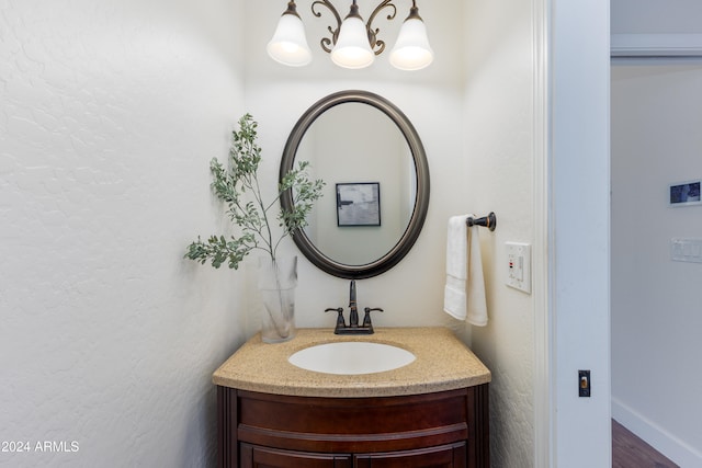 bathroom featuring wood-type flooring and vanity