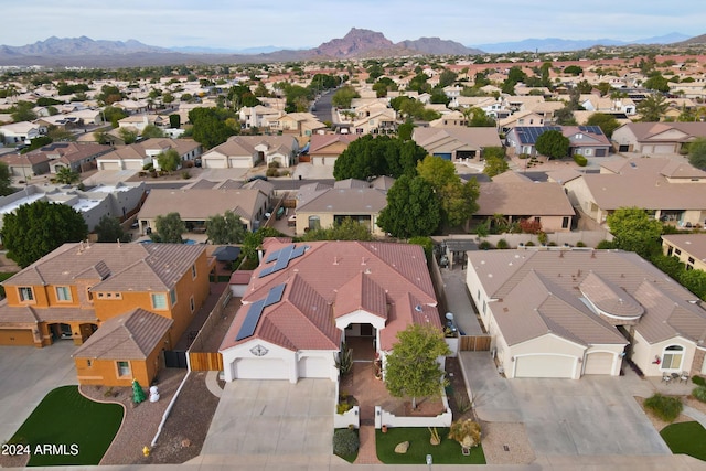 birds eye view of property with a mountain view