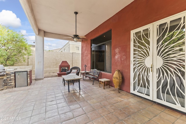 view of patio with ceiling fan and exterior kitchen