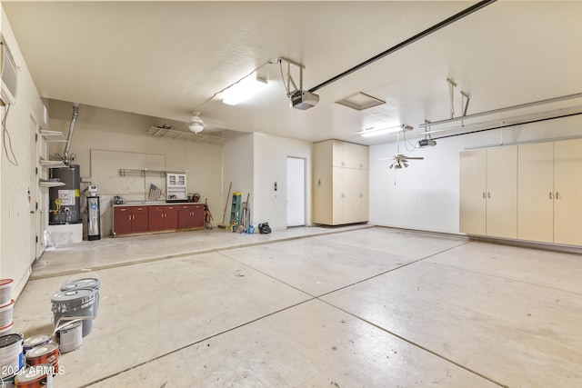 garage featuring gas water heater and a garage door opener