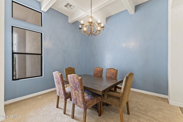 dining area featuring beamed ceiling, light colored carpet, and an inviting chandelier