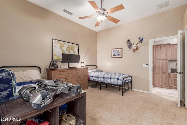 carpeted bedroom featuring ceiling fan