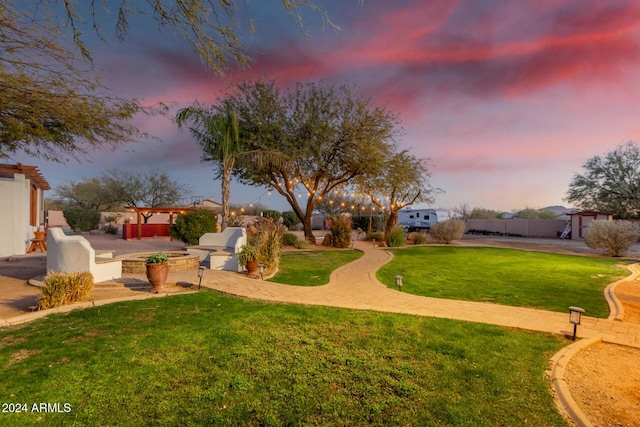 yard at dusk with a patio