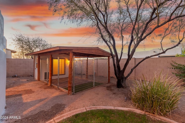 view of outdoor structure at dusk