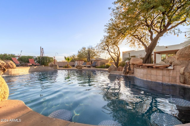 view of pool with pool water feature