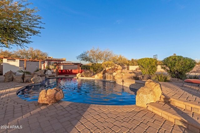 view of pool with a pergola and a patio