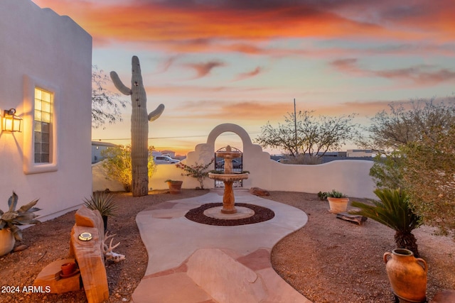 view of patio terrace at dusk