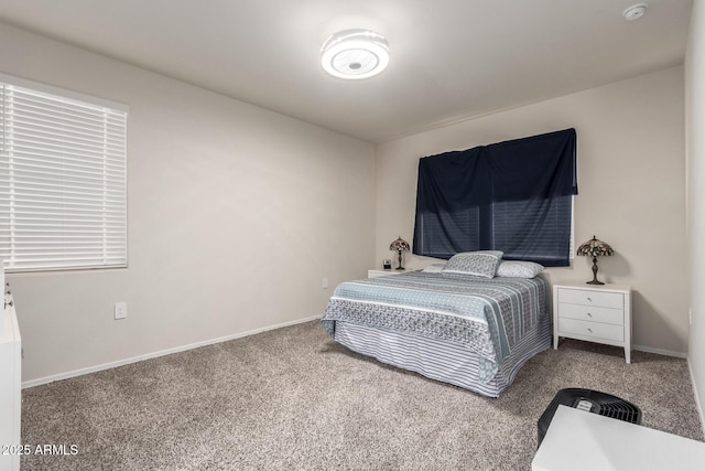 carpeted bedroom featuring baseboards