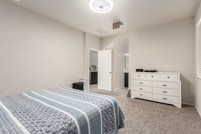 bedroom featuring baseboards, visible vents, and light colored carpet