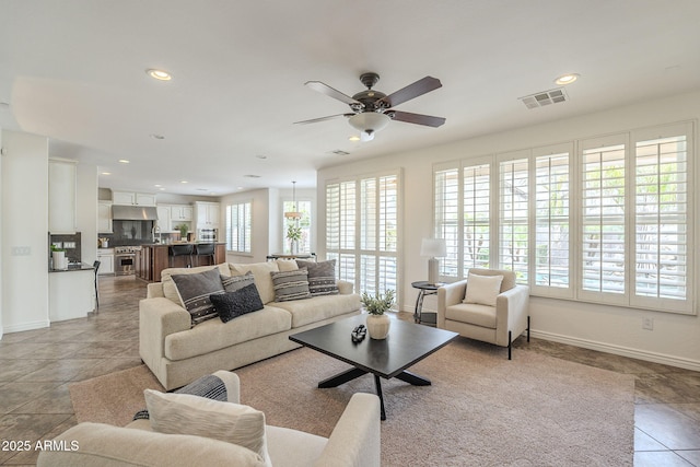 living room with visible vents, baseboards, ceiling fan, recessed lighting, and light tile patterned flooring