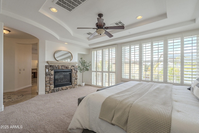 carpeted bedroom with visible vents, recessed lighting, and a tray ceiling