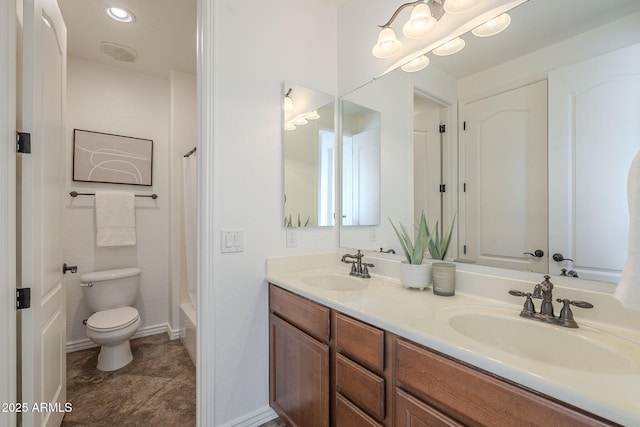 bathroom with double vanity, toilet, shower / bath combo, and a sink