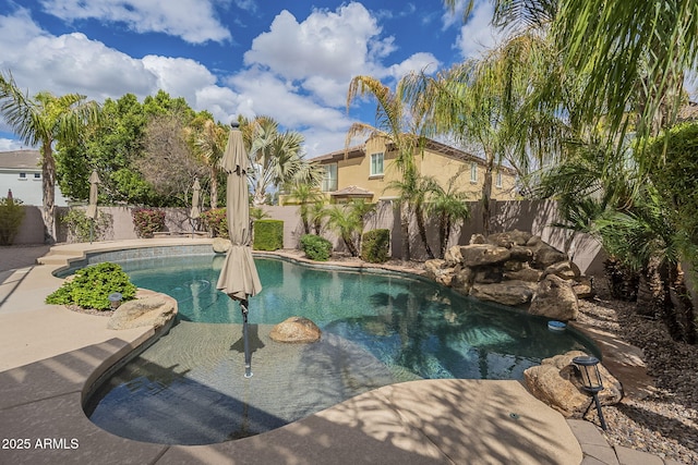 view of pool featuring a patio area, a fenced backyard, and a fenced in pool