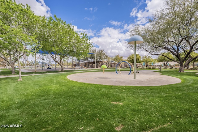 view of community with a lawn and playground community