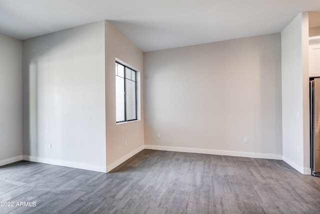 empty room with light hardwood / wood-style floors