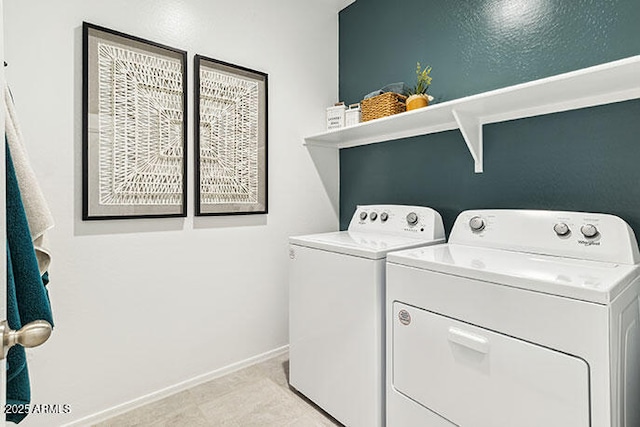 clothes washing area featuring independent washer and dryer