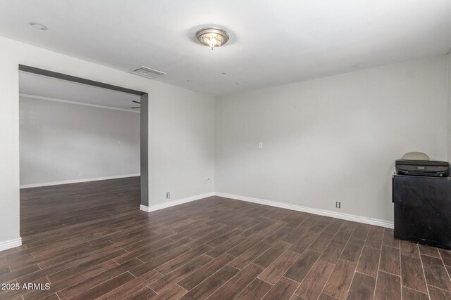 2938 N 18th Ave, Phoenix, AZ 85015 - spare room with dark wood-style floors and baseboards