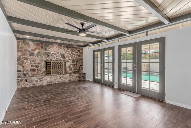 2938 N 18th Ave, Phoenix, AZ 85015 - unfurnished living room featuring french doors, beamed ceiling, ceiling fan, baseboards, and wood finished floors