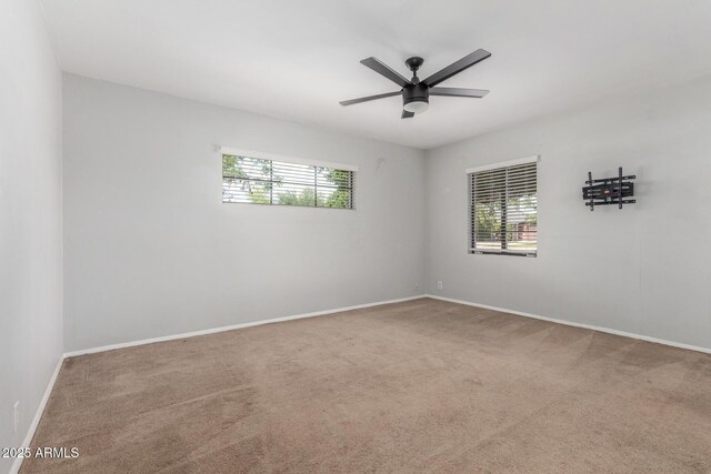 2938 N 18th Ave, Phoenix, AZ 85015 - empty room featuring carpet flooring, baseboards, and ceiling fan