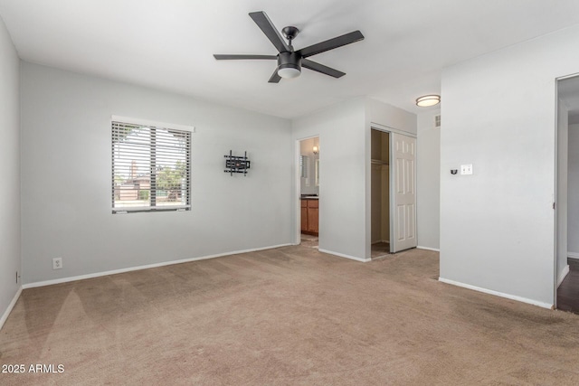 2938 N 18th Ave, Phoenix, AZ 85015 - unfurnished bedroom featuring light carpet, a closet, baseboards, and ensuite bathroom