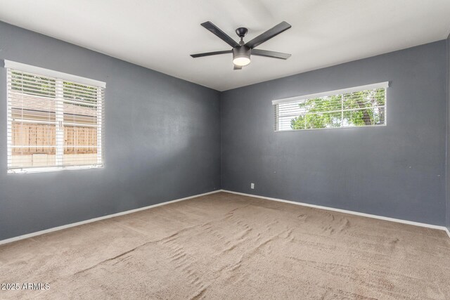 2938 N 18th Ave, Phoenix, AZ 85015 - carpeted empty room with baseboards and ceiling fan