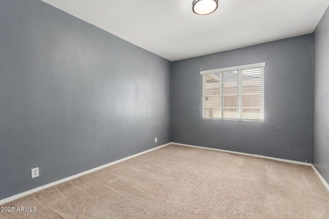 2938 N 18th Ave, Phoenix, AZ 85015 - carpeted empty room with baseboards