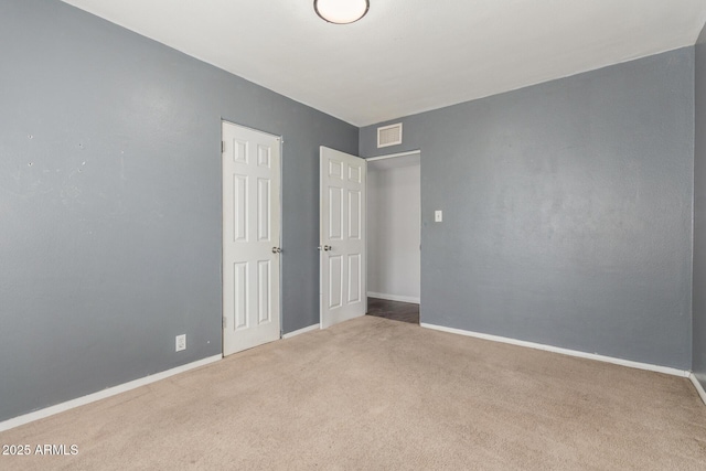 2938 N 18th Ave, Phoenix, AZ 85015 - unfurnished bedroom featuring carpet flooring and baseboards
