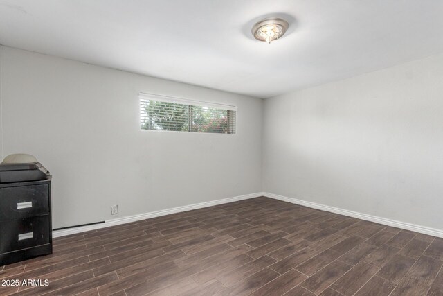 2938 N 18th Ave, Phoenix, AZ 85015 - empty room with dark wood finished floors and baseboards