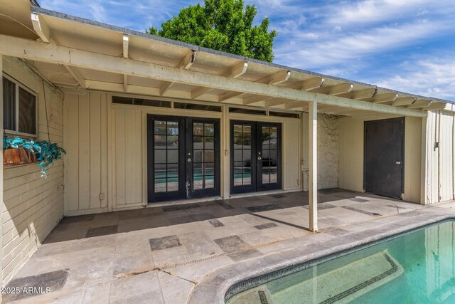 2938 N 18th Ave, Phoenix, AZ 85015 - swimming pool with french doors and a patio area