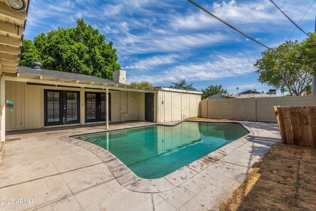 2938 N 18th Ave, Phoenix, AZ 85015 - view of swimming pool with french doors, a patio, and a fenced backyard