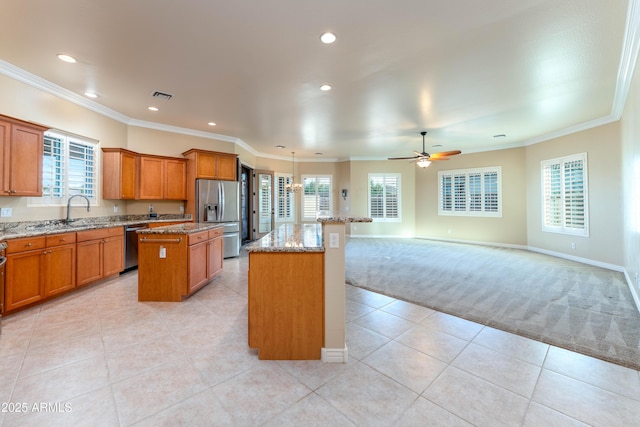 7969 S 172nd St, Queen Creek, AZ 85142 - kitchen featuring a kitchen island, appliances with stainless steel finishes, brown cabinetry, ceiling fan, and recessed lighting