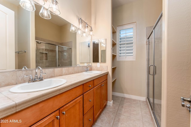 7969 S 172nd St, Queen Creek, AZ 85142 - bathroom featuring a stall shower, double vanity, and tile patterned flooring