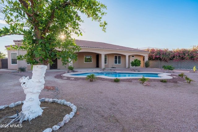 7969 S 172nd St, Queen Creek, AZ 85142 - rear view of house with a tile roof, stucco siding, fence, and a patio area