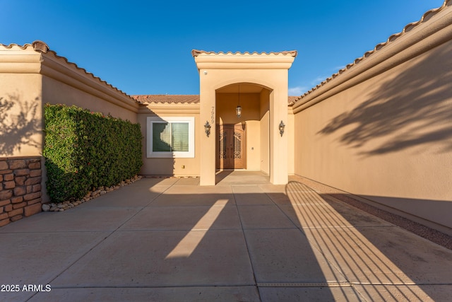 7969 S 172nd St, Queen Creek, AZ 85142 - doorway to property with stucco siding and a tiled roof