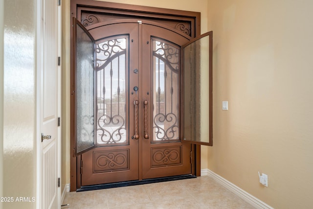 7969 S 172nd St, Queen Creek, AZ 85142 - tiled entryway with french doors and baseboards