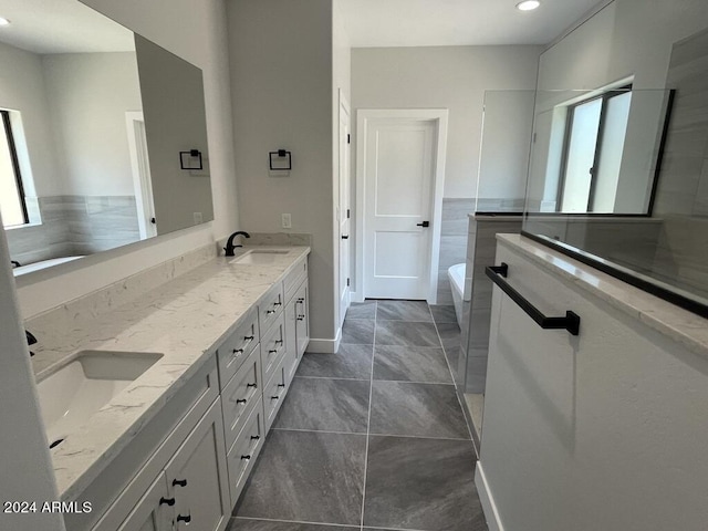 bathroom with vanity and a bathing tub