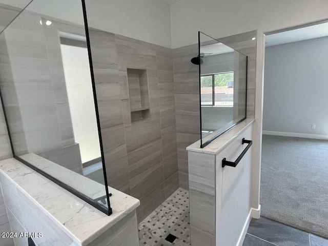 bathroom with a tile shower