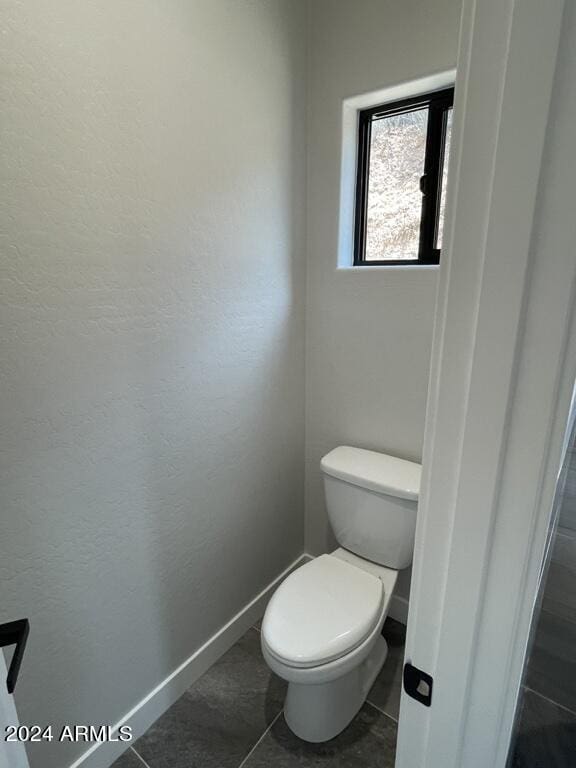 bathroom featuring tile patterned floors and toilet