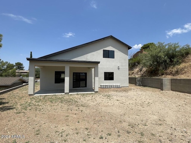 rear view of house featuring a patio