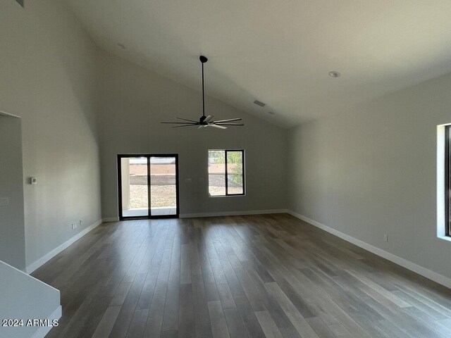 unfurnished living room featuring hardwood / wood-style flooring, ceiling fan, and high vaulted ceiling