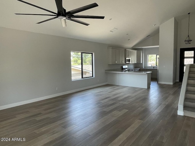 kitchen with pendant lighting, range, white cabinetry, dark hardwood / wood-style floors, and kitchen peninsula