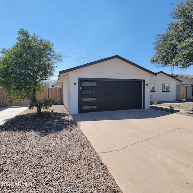 single story home with a garage